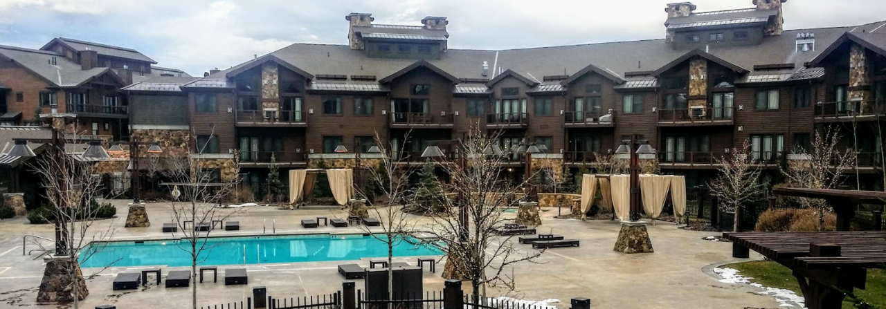 Exterior view of Waldorf Astoria Park City condos, showcasing a luxury ski condo-hotel located in the heart of Canyons Village in Park City, Utah